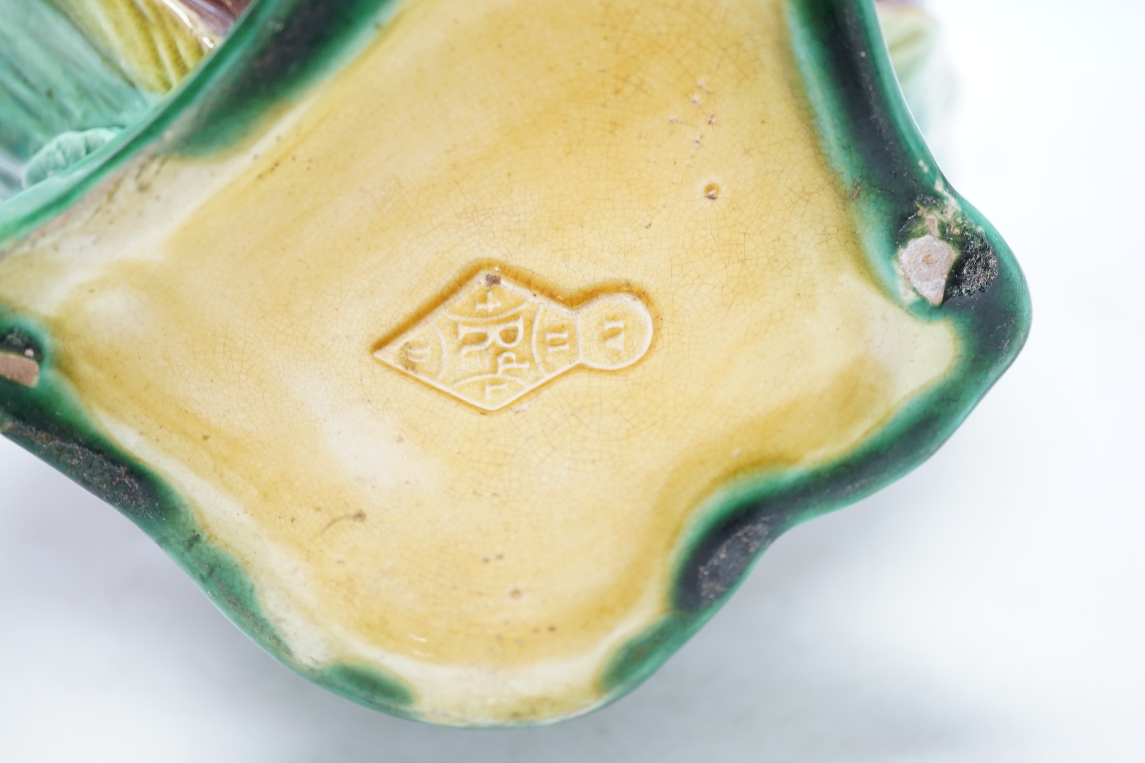 A large Victorian majolica jug, 26cm. Condition - fair